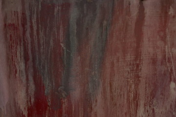 red metal background painted in red with scratches