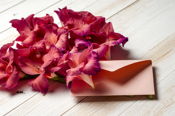 Colorful flowers in envelope, flower delivery concept. congratulate.