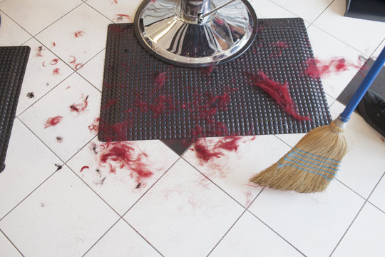 The dirty floor of a hair salon.