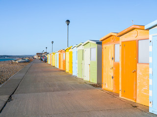 View of Beach Huts on Seaford Promenade in Sussex