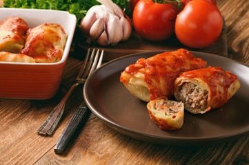 Stuffed cabbage leaves with minced meat and rice in tomato sauce.