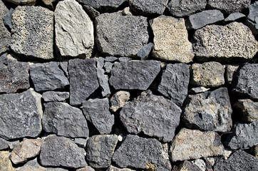 Fototapeta premium Close up of old stone wall texture. Architecture vintage brick background