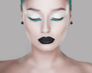 creative and futuristic look of fashion woman with green hair