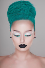 creative and futuristic look of fashion woman with green hair