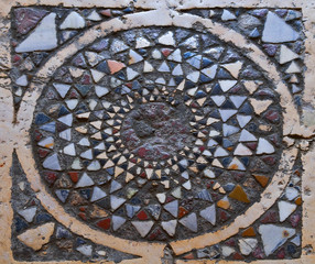 Ancient Turkish mosaic on a mausoleum floor in Mevlan, Turkey.