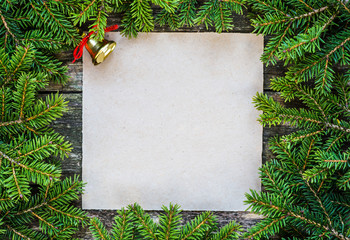 Christmas fir tree with decoration on a wooden board