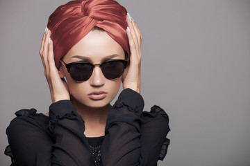 beautiful and fashion girl in sunglasses, close-up portrait, studio shot