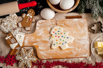 cooking christmas gingerbread on wooden background top view