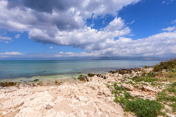 Fototapeta na wymiar Agios Spiridon beach, one of the most quiet and beautiful beaches located in the northeast coast of Corfu, Greece. Europe.