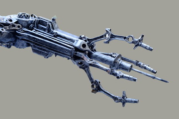 Left arm of a robot made from car parts and spares. Isolated on gray background