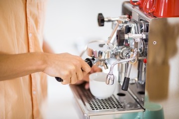 Man preparing coffee from coffeemaker
