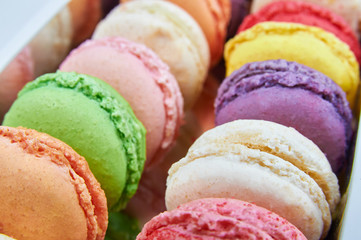 Colorful french macaroons in a box