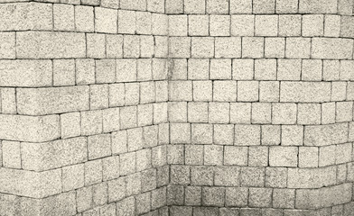 Corner brick wall