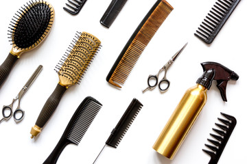 combs and hairdresser tools on white background top view