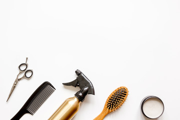 combs and hairdresser tools on white background top view