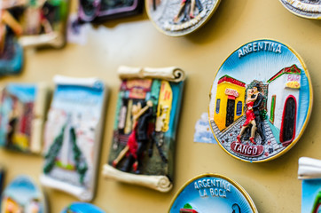 Fridge magnets with traditional tango dancers at a weekend fair in San Telmo neighborhood, Buenos...