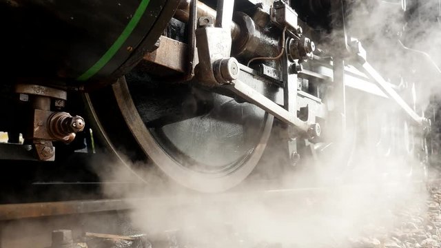 wheels of steam engine train. old locomotive background.