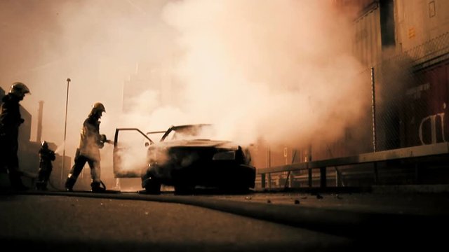 firefighter deleting burning car background.