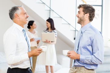 Businessmen interacting during a break time