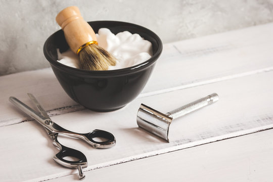 Wooden desktop with tools for shaving beards