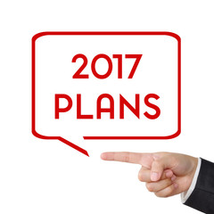 Businessman hand pointing 2017 plans sign on white background