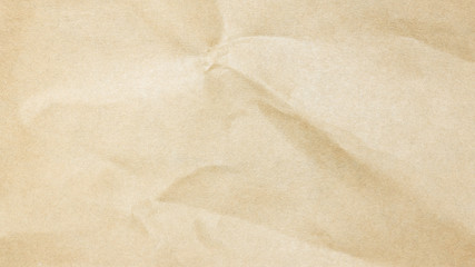 Recycled crumpled brown paper texture or paper background for design with copy space for text or image.