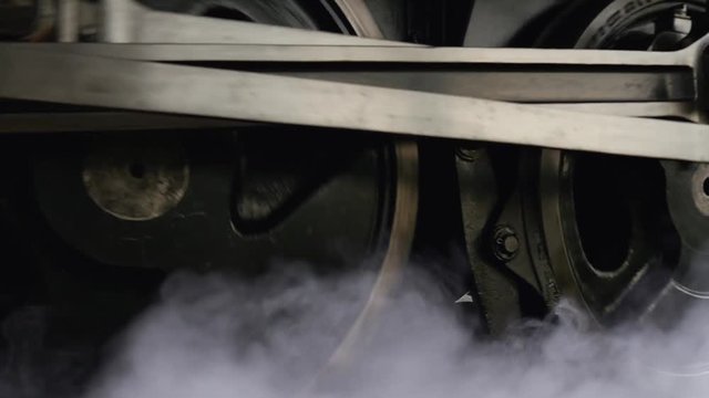 close up of wheels of steam engine locomotive train.