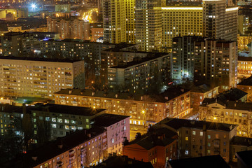 Night View of different city houses from roof top, streets, night lights, modern