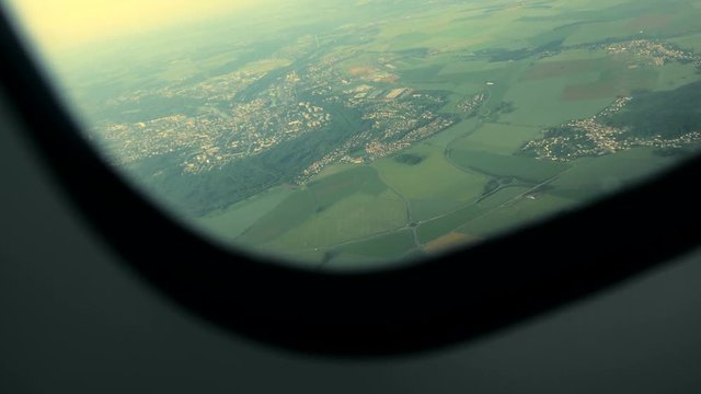 airplane window view. flight flying airborne. plane aircraft. in the air background. shot in 4k.