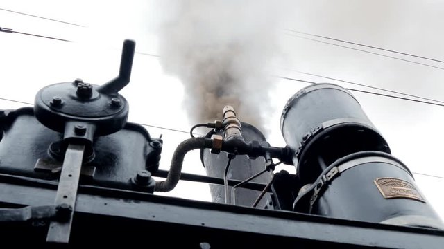 industrial steam engine locomotive. black steel metal background.