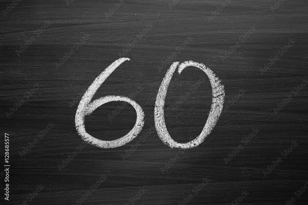 Wall mural number sixty enumeration written with a chalk on the blackboard