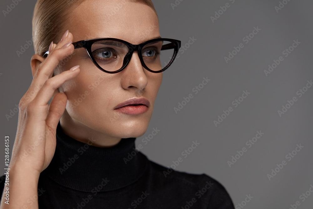 Wall mural female eyewear style. beautiful woman in fashion eyeglasses