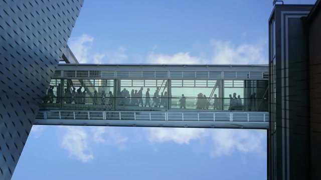 business people inside a modern glass building.