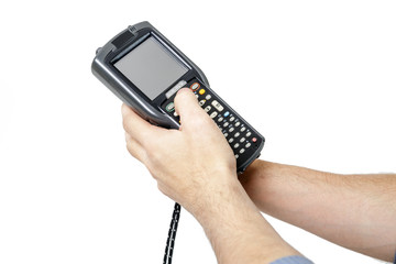 Man's hand holding a barcode scanner.  His second hand presses the button on the scanner keyboard. The scanning device is directed upwards to the left. Isolated on white background.