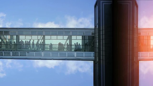 business people inside a modern glass building.