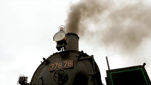 Historical steam engine train locomotive. old technology background. nostalgic retro vintage style.