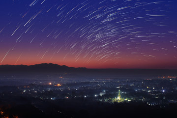 Beautiful scenery during the twilight before the sun rise and star trail of top view at Mandalay hill in Myanmar. is a beautiful location and very popular for tourists and photographer