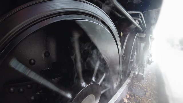 close up of steam engine wheels. locomotive background.