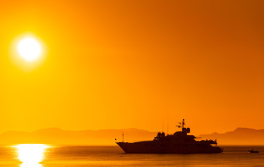 Silhouette of a luxurious yacht on the sea of cortez at sunset