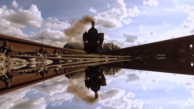 overhead shot of steam engine train locomotive. mirror reflection background. nostalgic retro style.