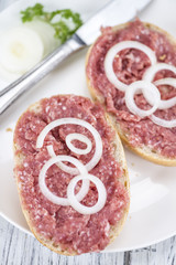 Bun with Mett (German cuisine; selective focus)