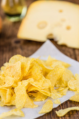 Cheese and Onion Potato Chips (selective focus) on vintage woode