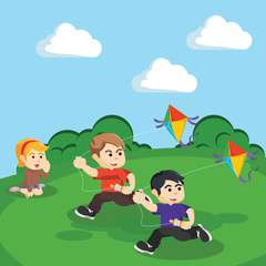 Obraz na płótnie Canvas kids playing kite at the hill