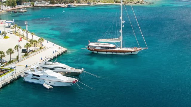 Yachts in the Clear Blue Water of Bodrum Turkey Docked at the Cruise Port of the Popular Turkish Resort Destination City