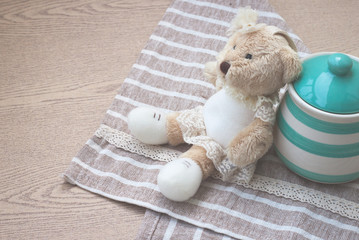 Matte style of green pastel porcelain jar and little bear doll with cute fabric.