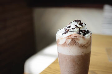 Ice cold coffee on a wooden table
