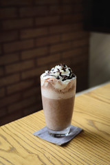 Ice cold coffee on a wooden table
