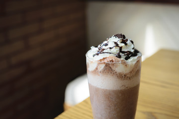 Ice cold coffee on a wooden table