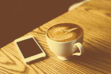 Fototapeta na wymiar Cup of coffee with beautiful Latte art