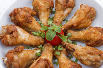 Fried chicken with fish sauce on white wood table, Thai food